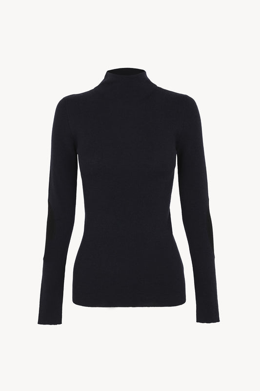 Cano, blue turtleneck jumper