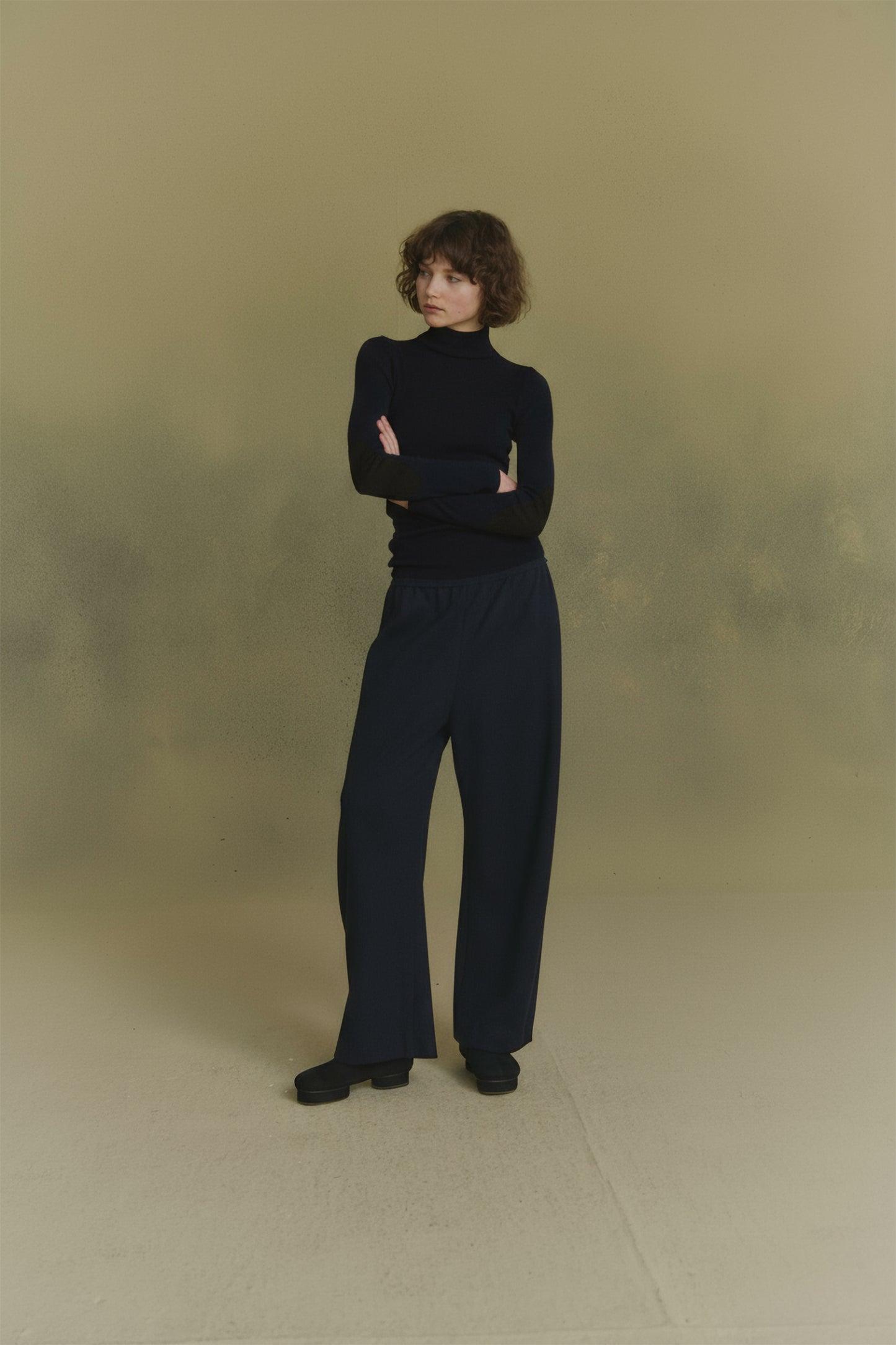 Cano, blue turtleneck jumper