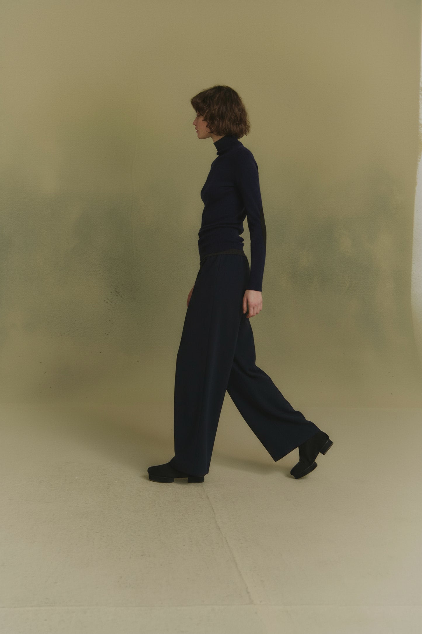 Cano, blue turtleneck jumper