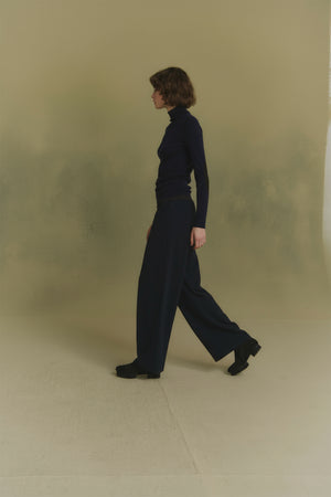 Cano, blue turtleneck jumper