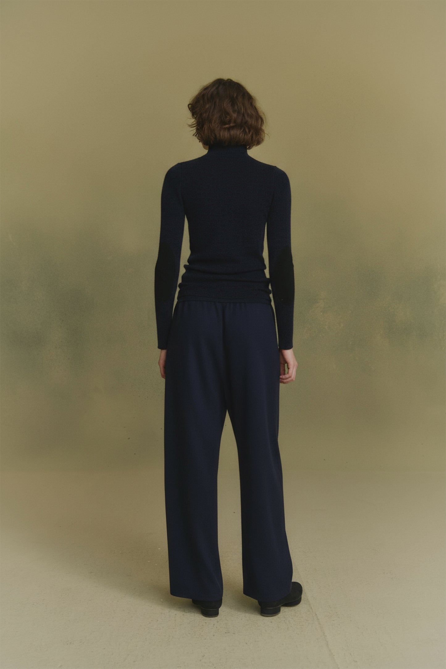 Cano, blue turtleneck jumper