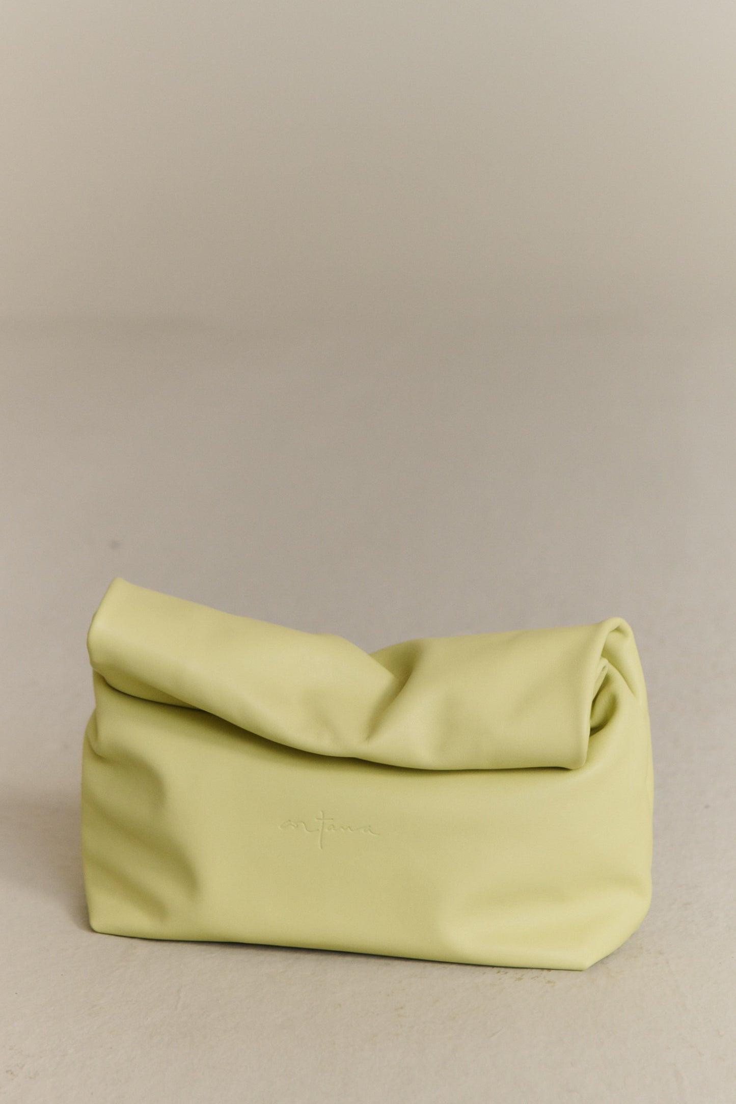 Delhi S, pale canary leather clutch