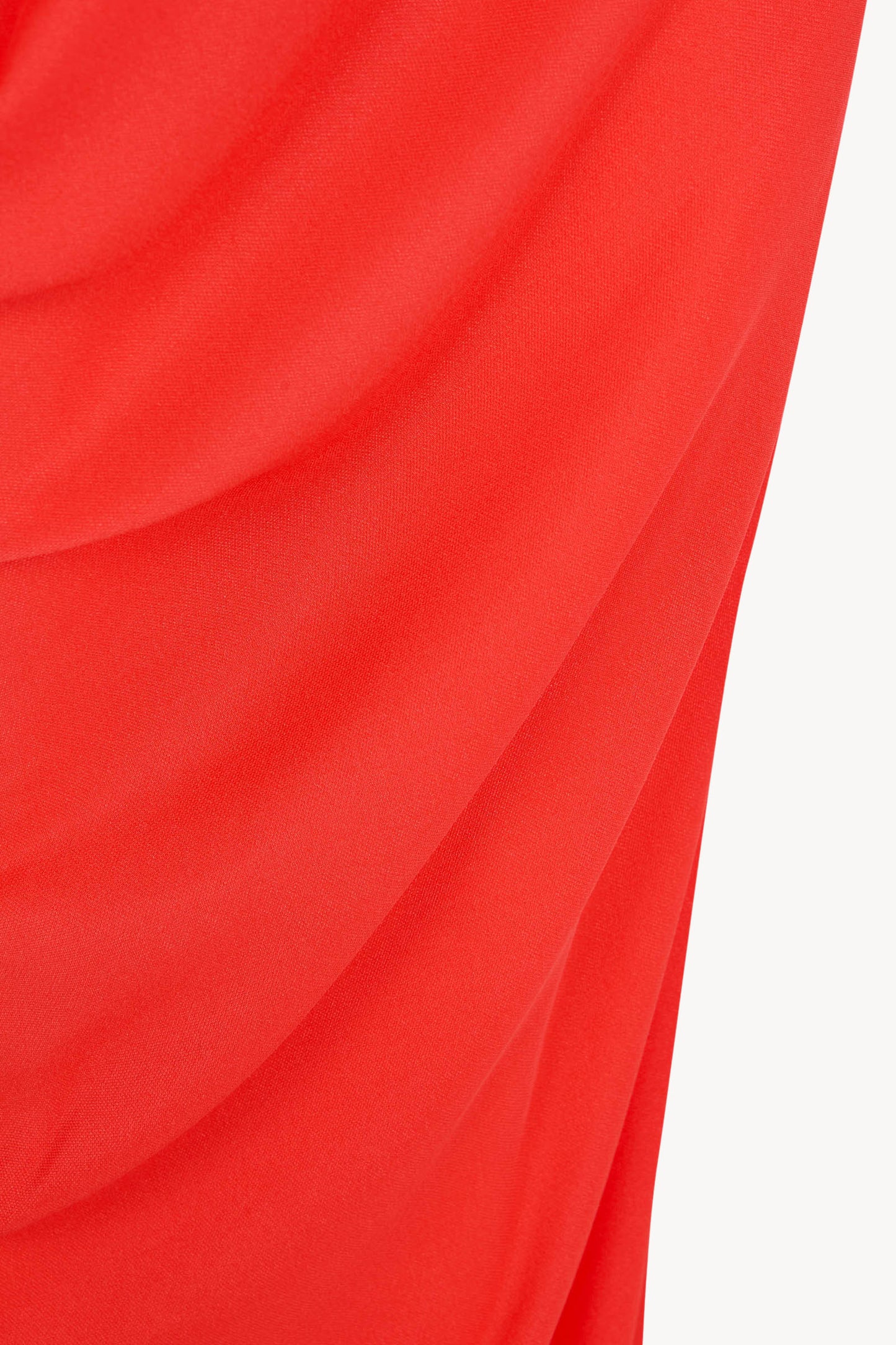 Delore, vestido asimetrico de seda rojo coral