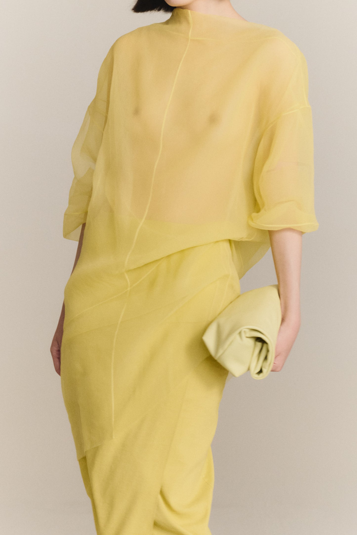 Delhi S, pale canary leather clutch