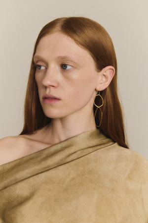 Irus L, gold earrings