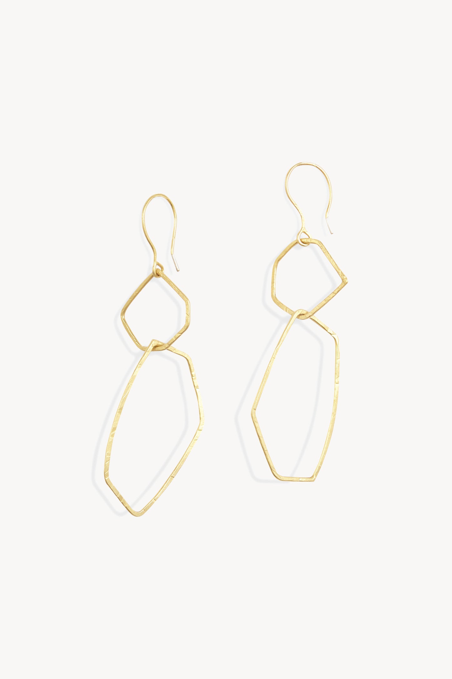 Irus L, gold earrings