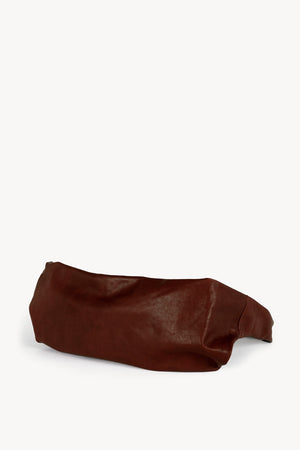 Jin L, dark maroon leather fanny pack