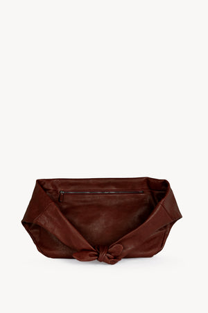 Jin L, dark maroon leather fanny pack