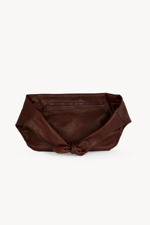 Jin L, dark maroon leather fanny pack