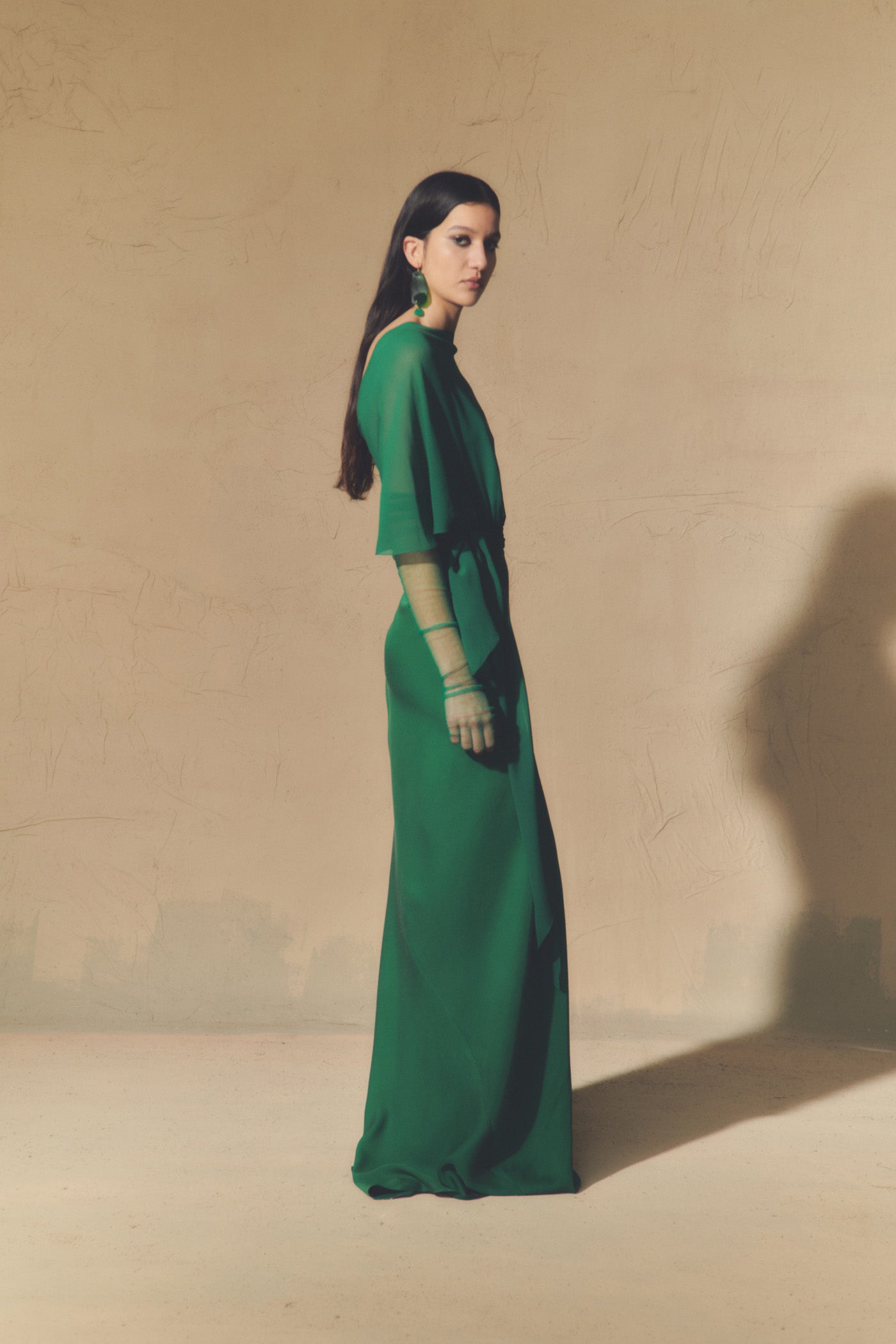 Land, emerald green silk dress