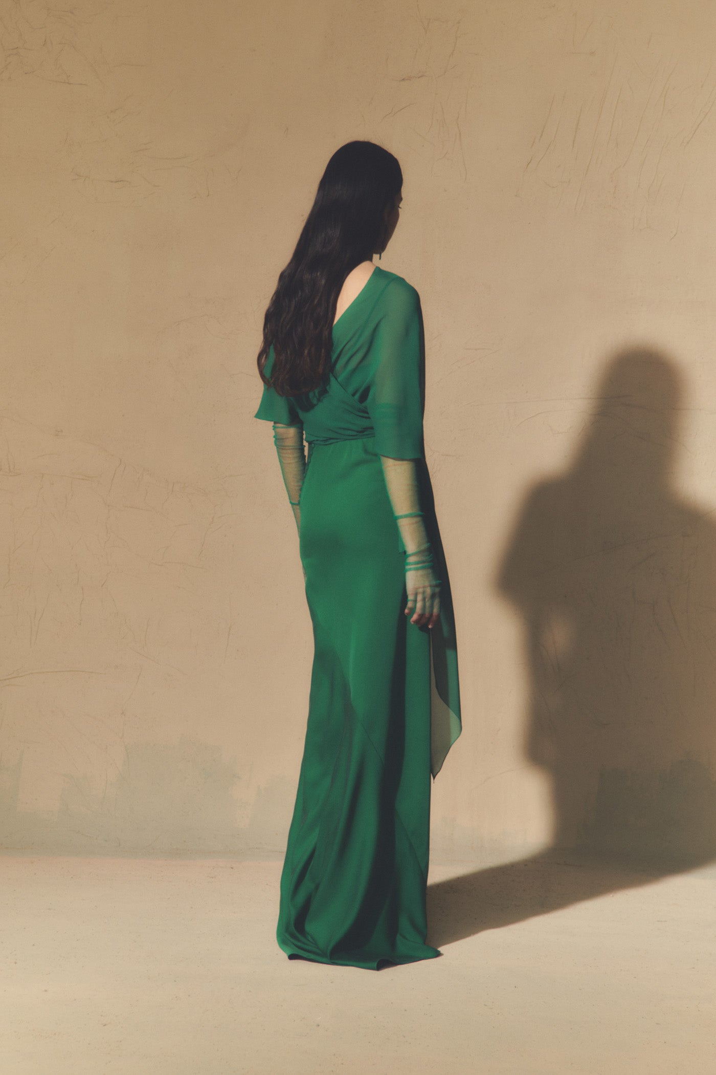 Land, emerald green silk dress