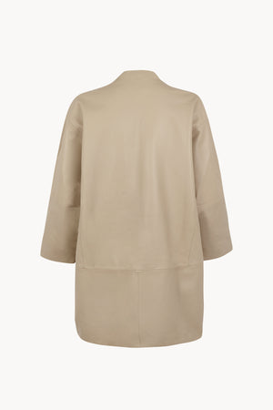 Lira, khaki fur coat