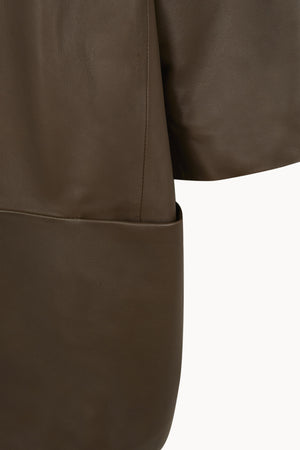 Lira, khaki fur coat