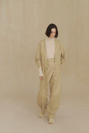 Lira, khaki fur coat