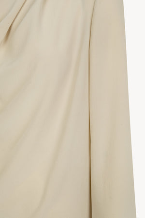 Lyra, blusa asimetrica de seda beige