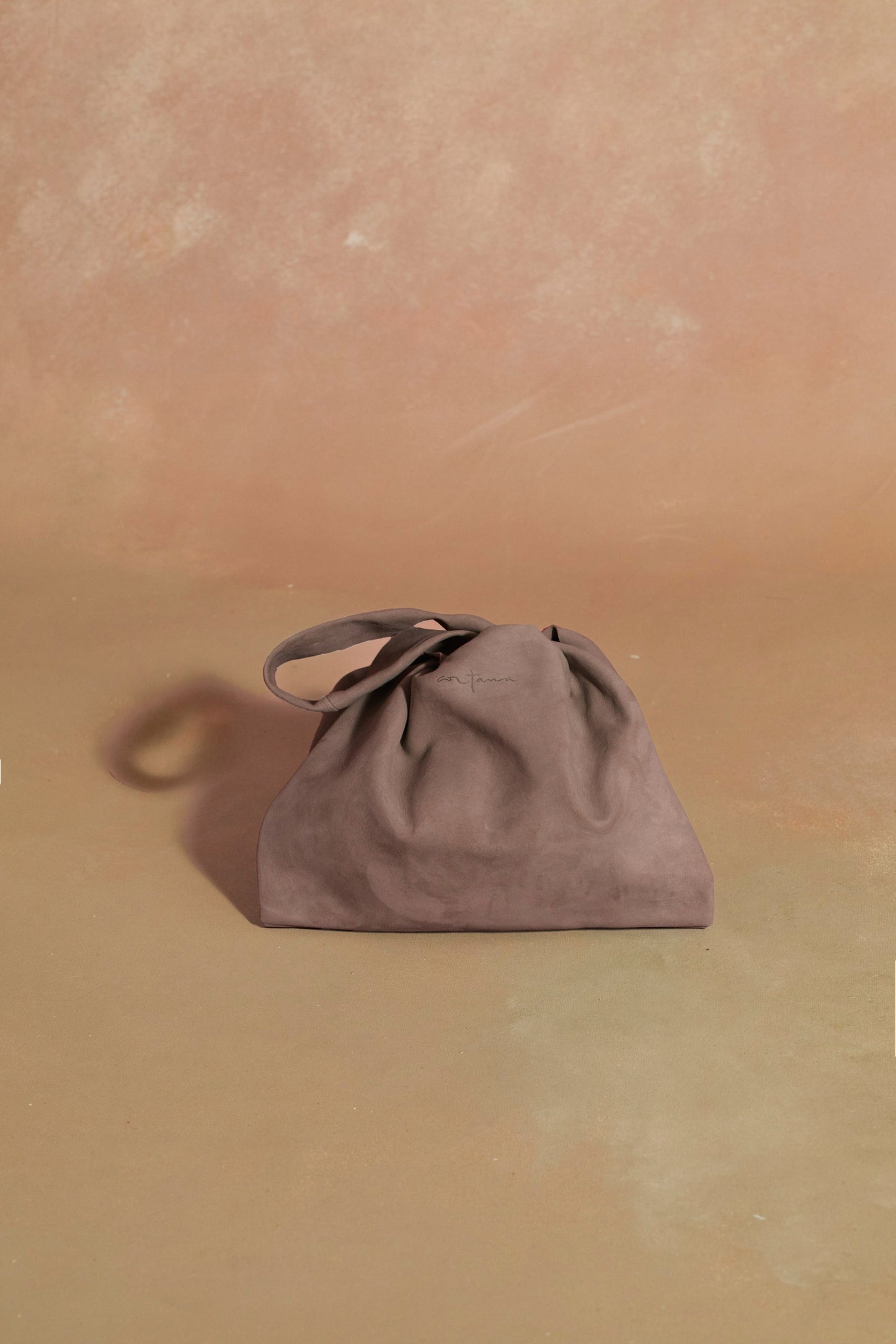 U XS, cocoa suede bag