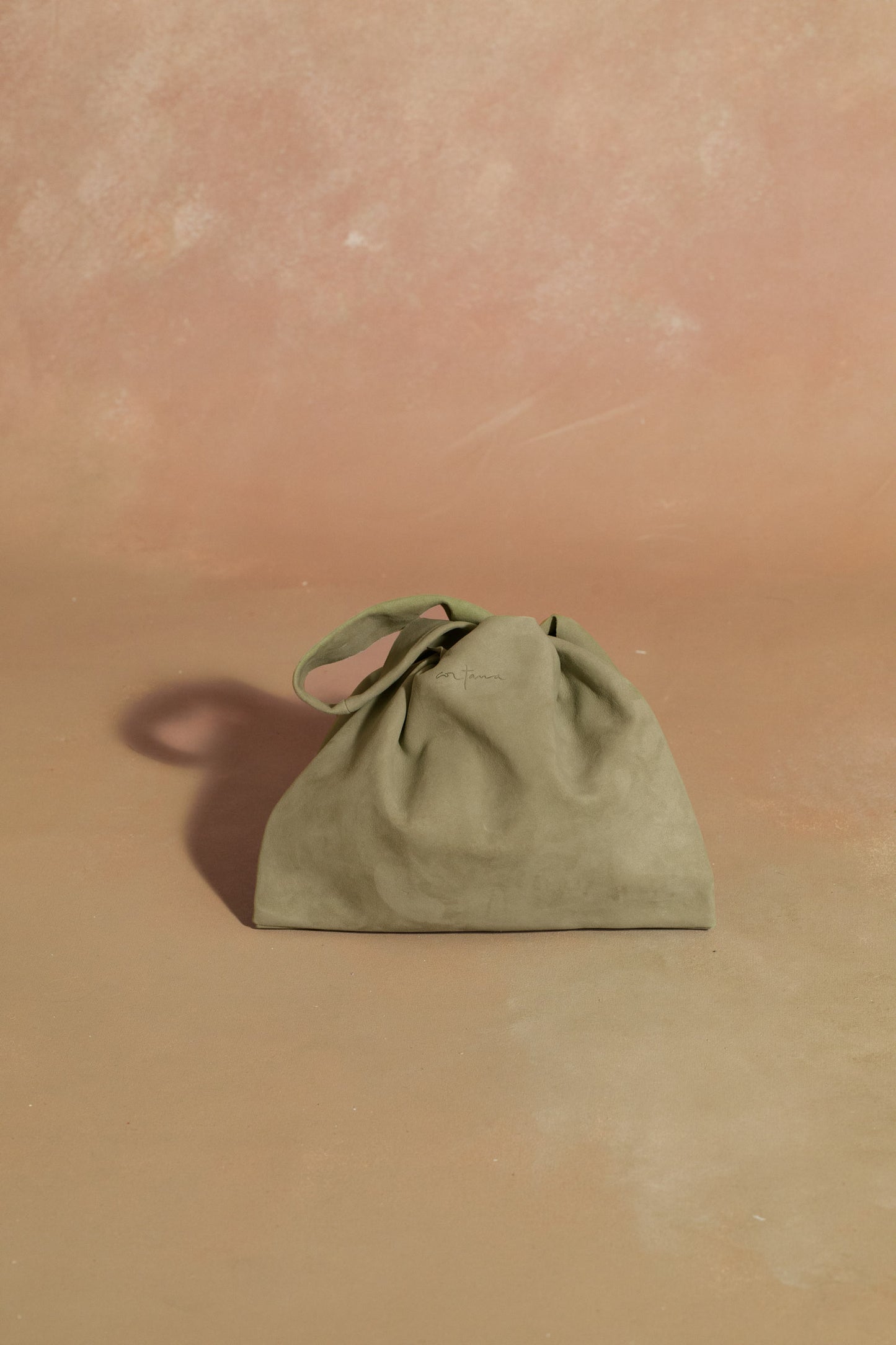 U XS, green suede bag