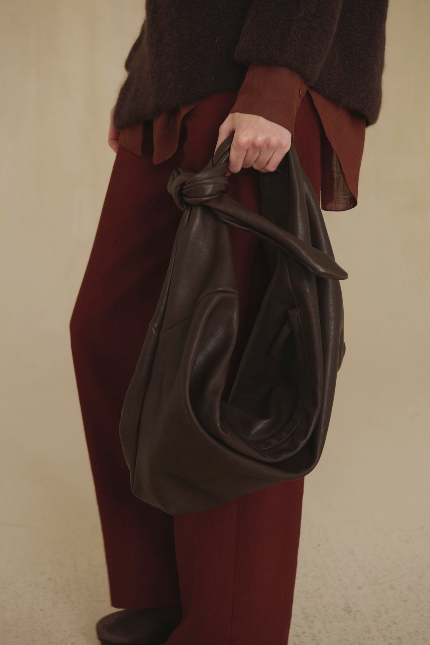 Jin L, dark brown leather belt bag